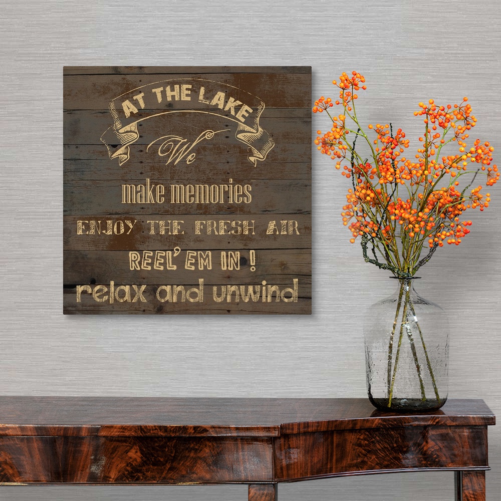 A traditional room featuring "At the Lake We Make Memories Enjoy the Fresh Air Reel 'em in! Relax and Unwind" on an aged wood ...