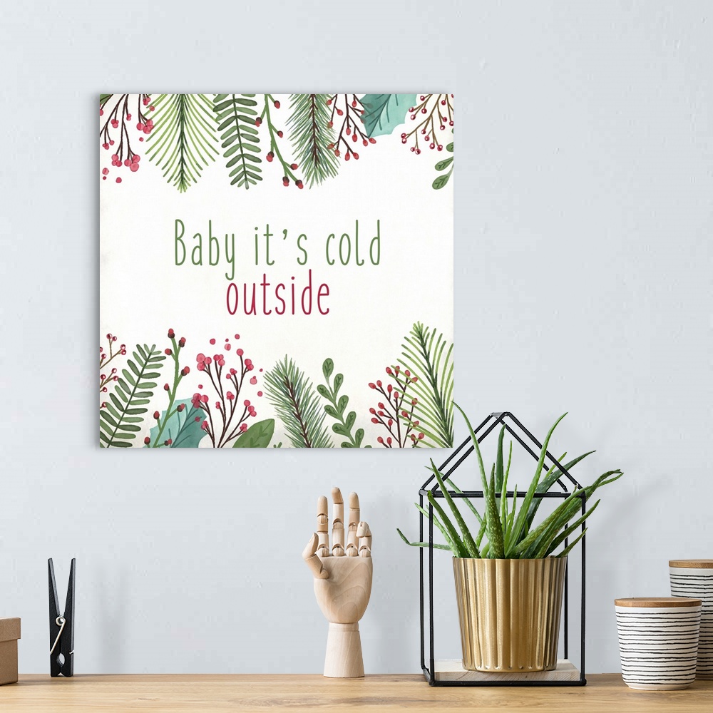 A bohemian room featuring Holiday typography art with a leaf and berry frame.