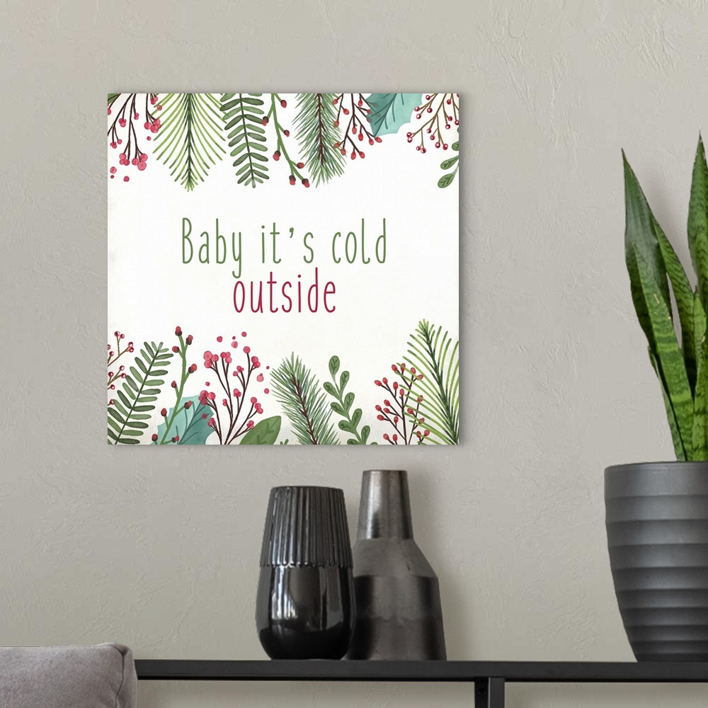 A modern room featuring Holiday typography art with a leaf and berry frame.