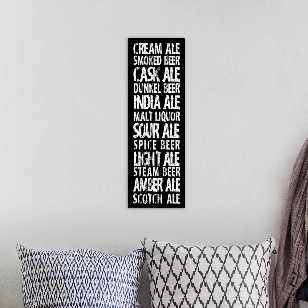 A bohemian room featuring Typography art in vertical orientation listing different kinds of beer, in a grungy urban style o...