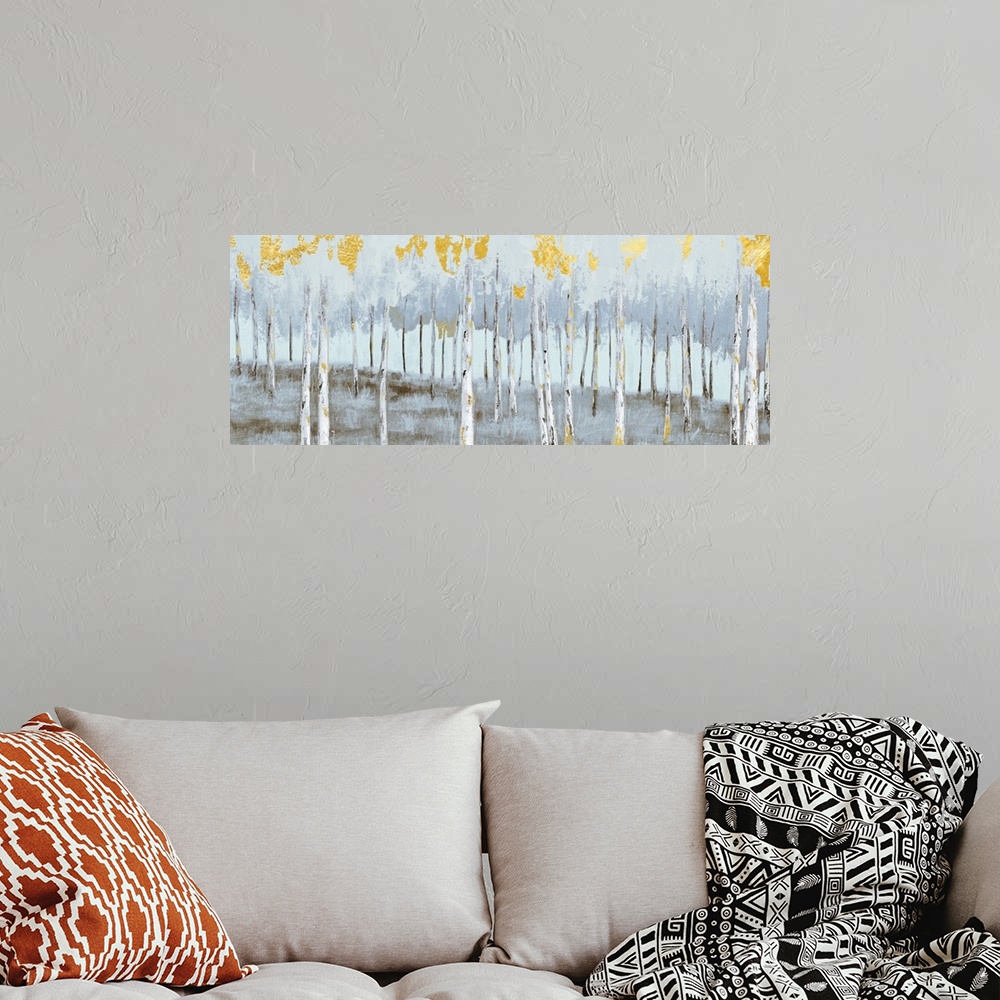 A bohemian room featuring Contemporary painting of a grove of grey birch trees with bright gold leaves.