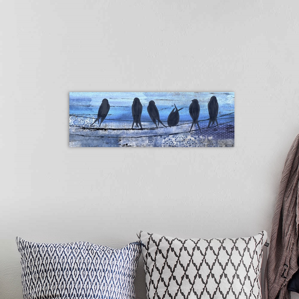 A bohemian room featuring Contemporary artwork of silhouetted birds on a line against a blue background.