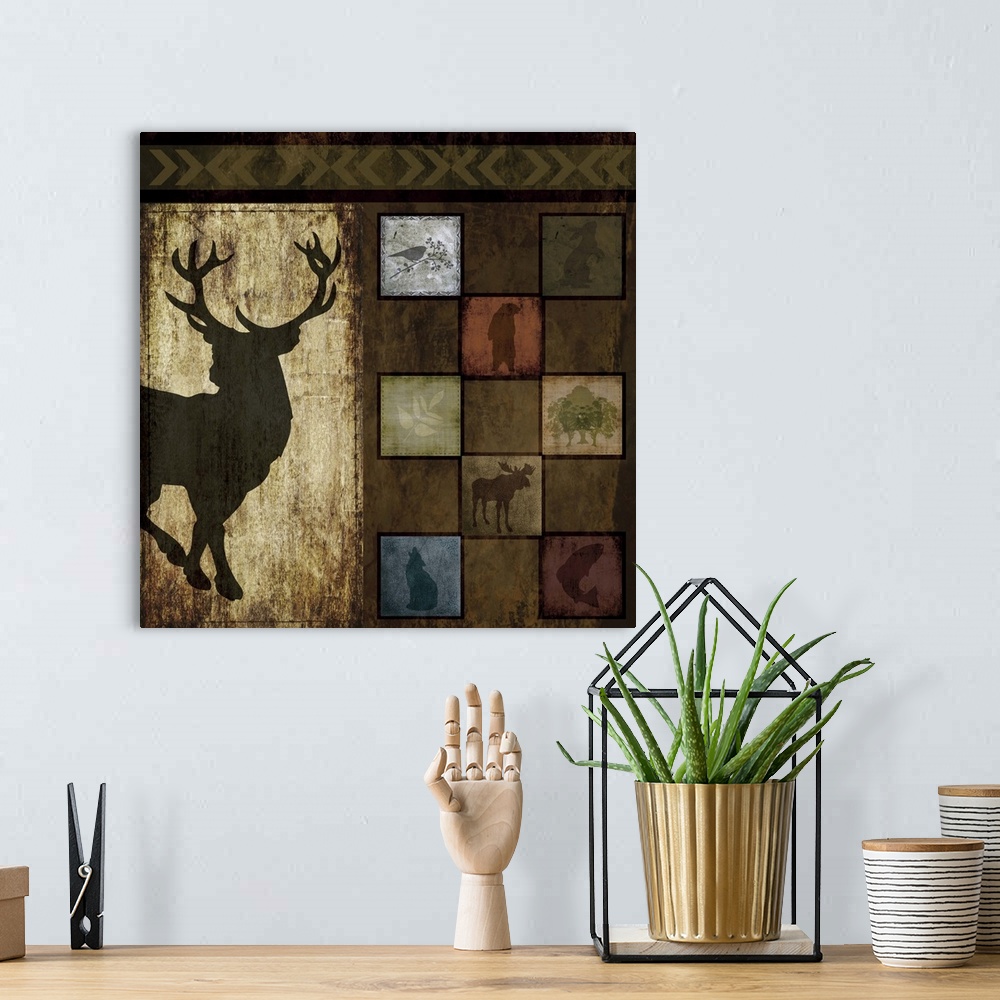 A bohemian room featuring Artwork of a silhouette of a stag next to tiles of other animal silhouettes.
