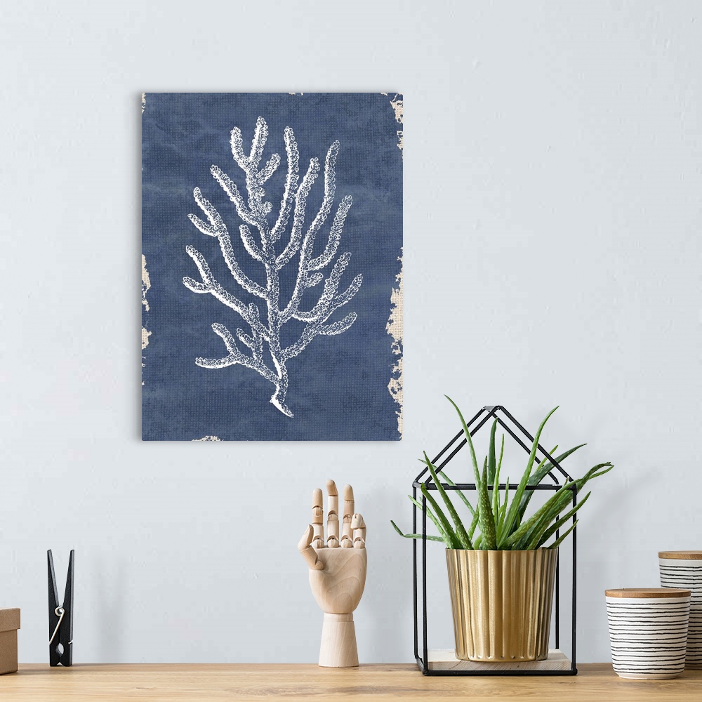 A bohemian room featuring White coral painting on a blue and tan burlap background.