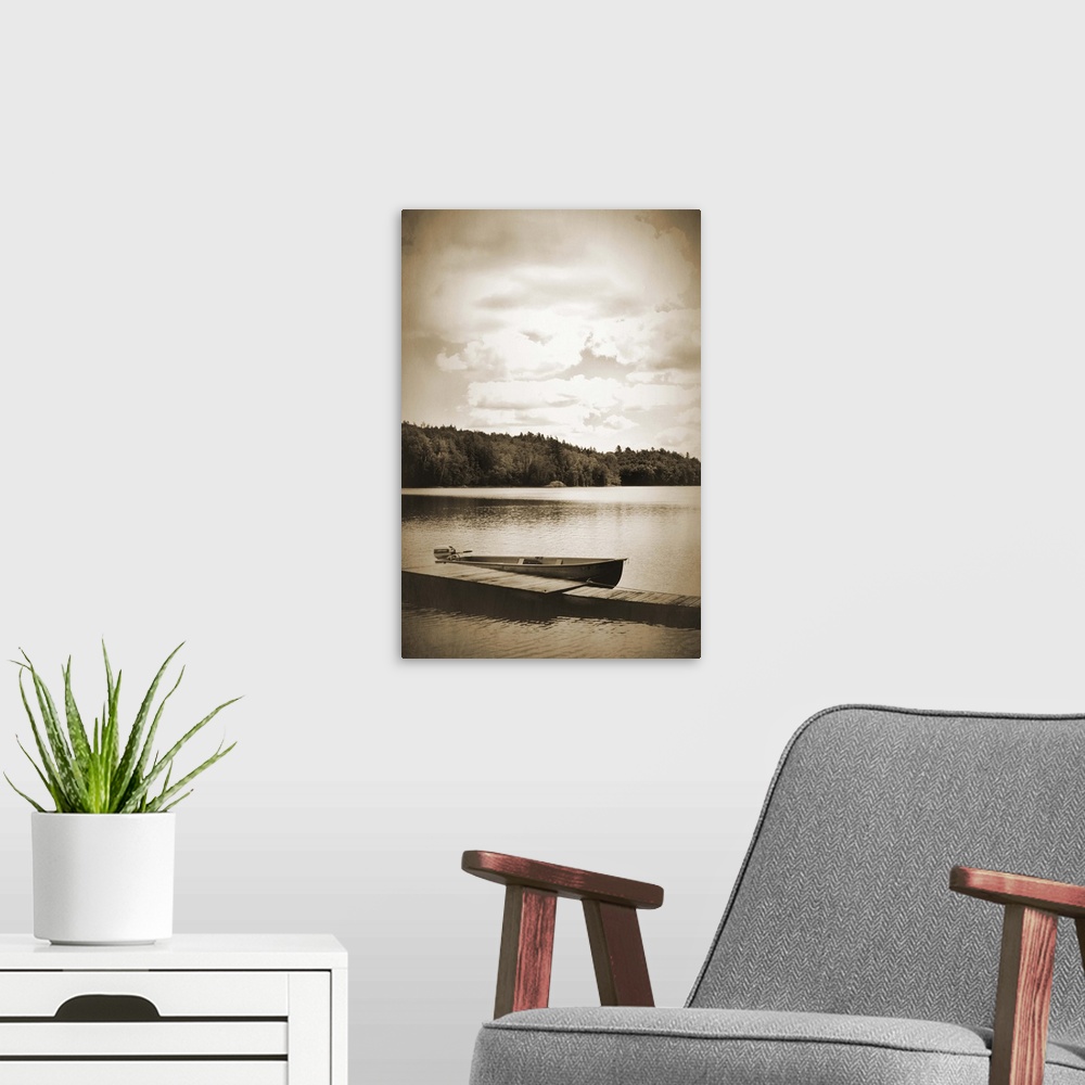 A modern room featuring Sepia toned photograph of a boat dock floating gently in a lake, with a boat docked beside it.