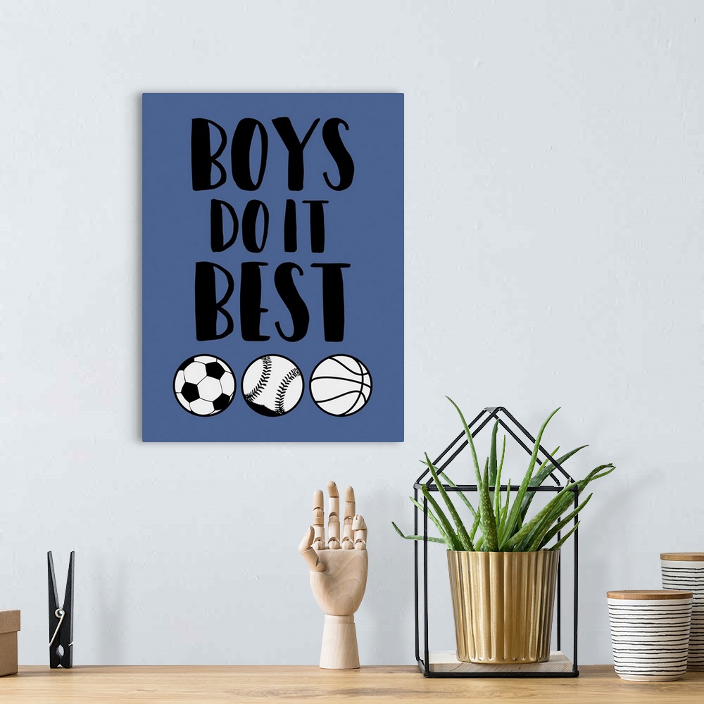 A bohemian room featuring Boy's room themed artwork with a soccer ball, baseball, and basketball design.