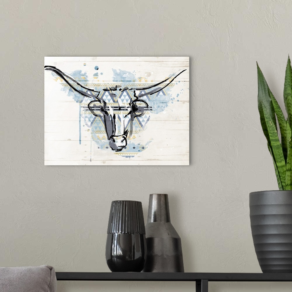 A modern room featuring A black outline of a bull?s head with a blue and yellow paint splatter and geometric shaped patte...