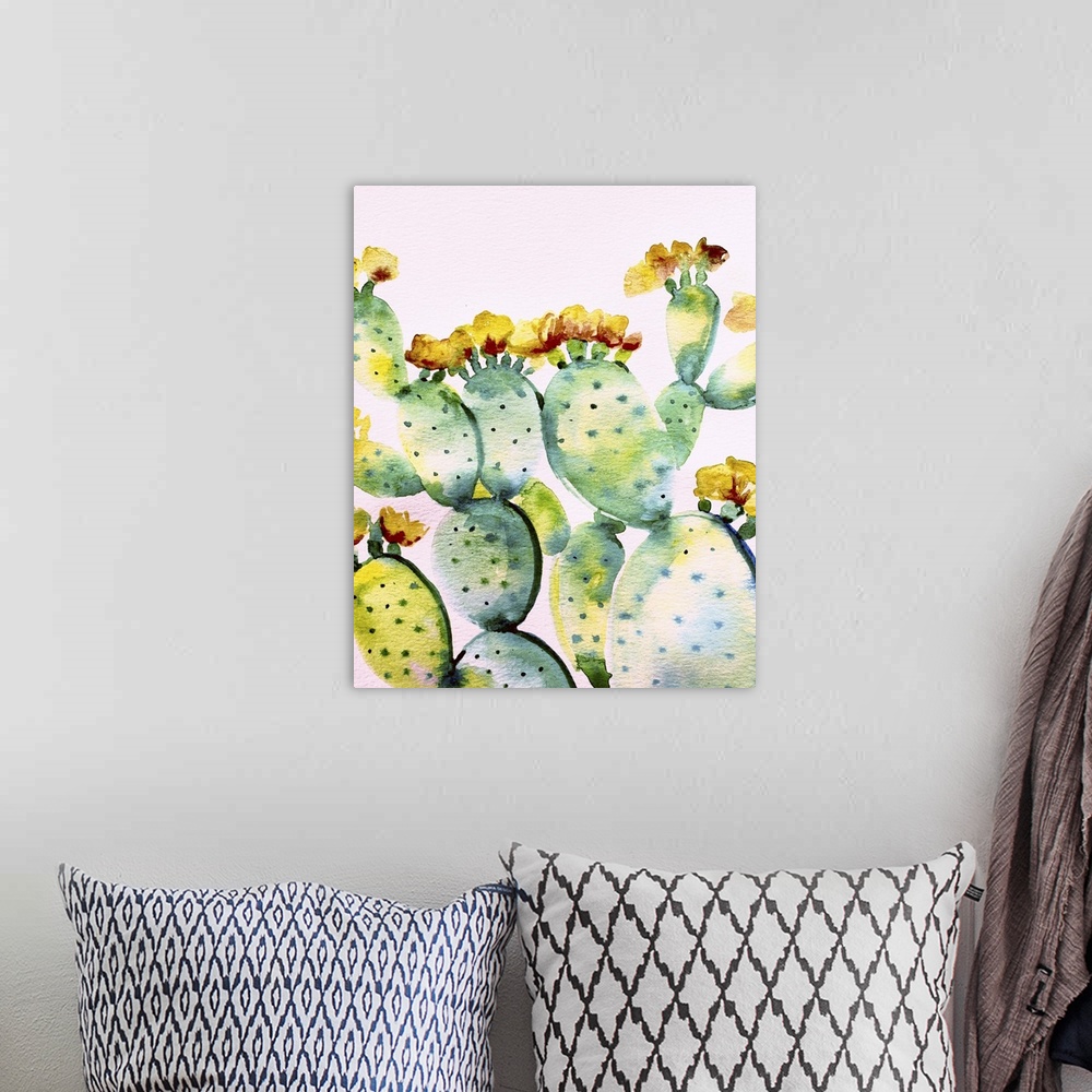 A bohemian room featuring Watercolor painting of a prickly pear cactus in shades of green, blue, yellow, and red on a white...