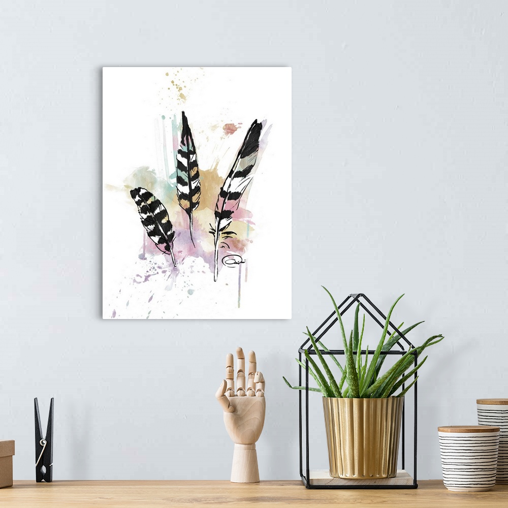 A bohemian room featuring A watercolor painting of three black and white feathers with a colorful, paint splattered backgro...
