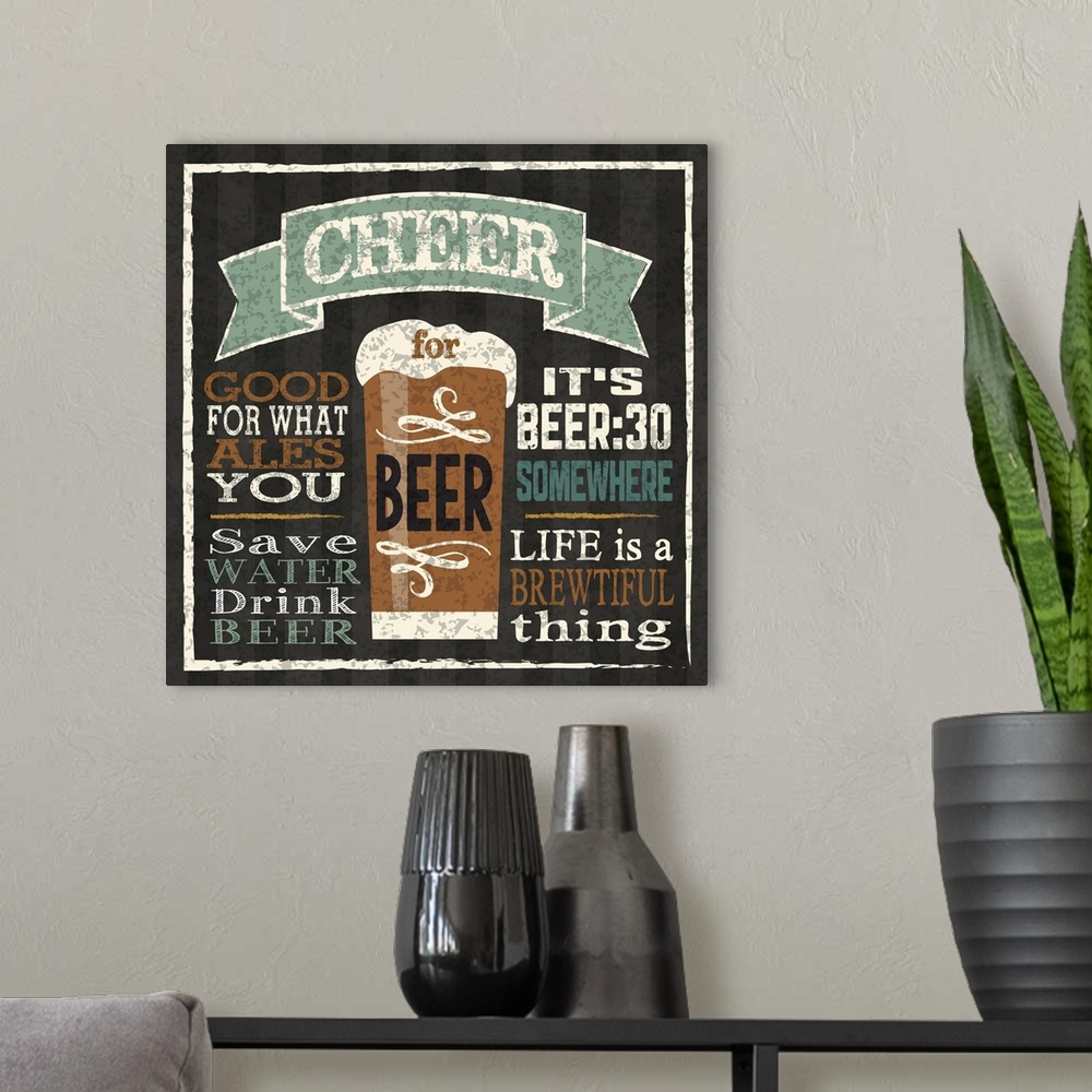 A modern room featuring Chalkboard style artwork featuring a  glass of beer and beer-related phrases.