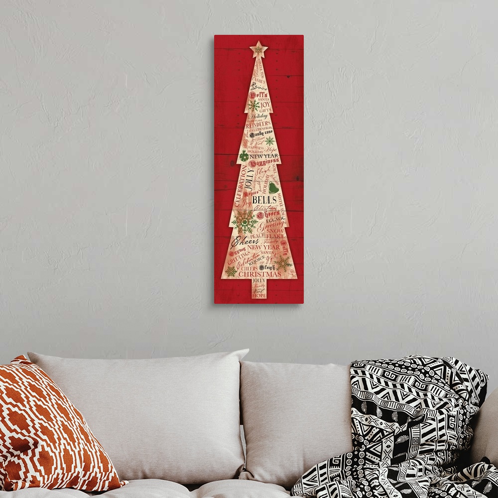 A bohemian room featuring Seasonal artwork of Christmas tree made of articles of newsprint against red background.