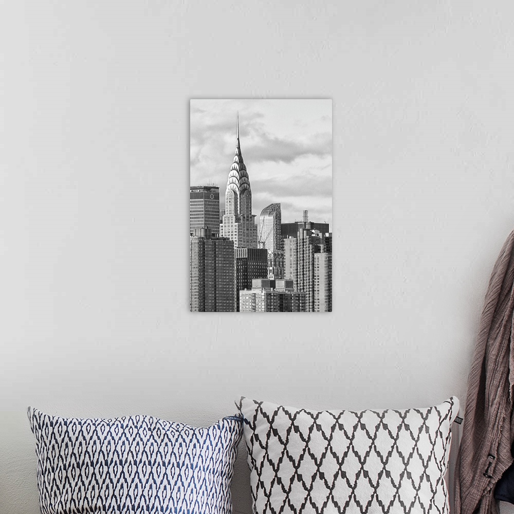 A bohemian room featuring Black and white photograph of the New York City skyline. With the Chrysler building prominently s...