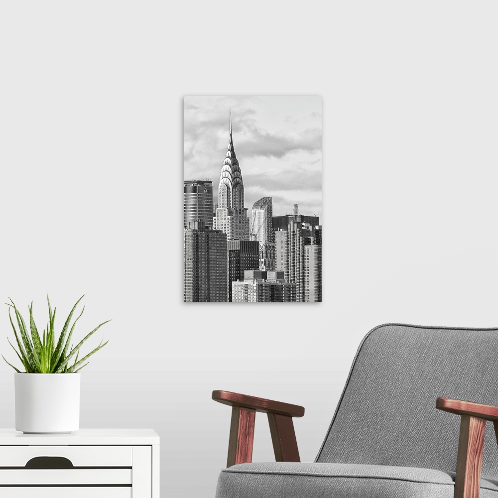 A modern room featuring Black and white photograph of the New York City skyline. With the Chrysler building prominently s...