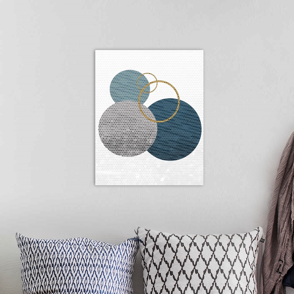A bohemian room featuring Contemporary geometric artwork made out of circles.
