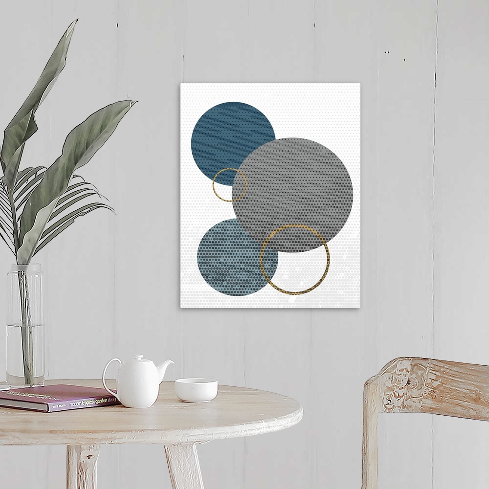 A farmhouse room featuring Contemporary geometric artwork made out of circles.