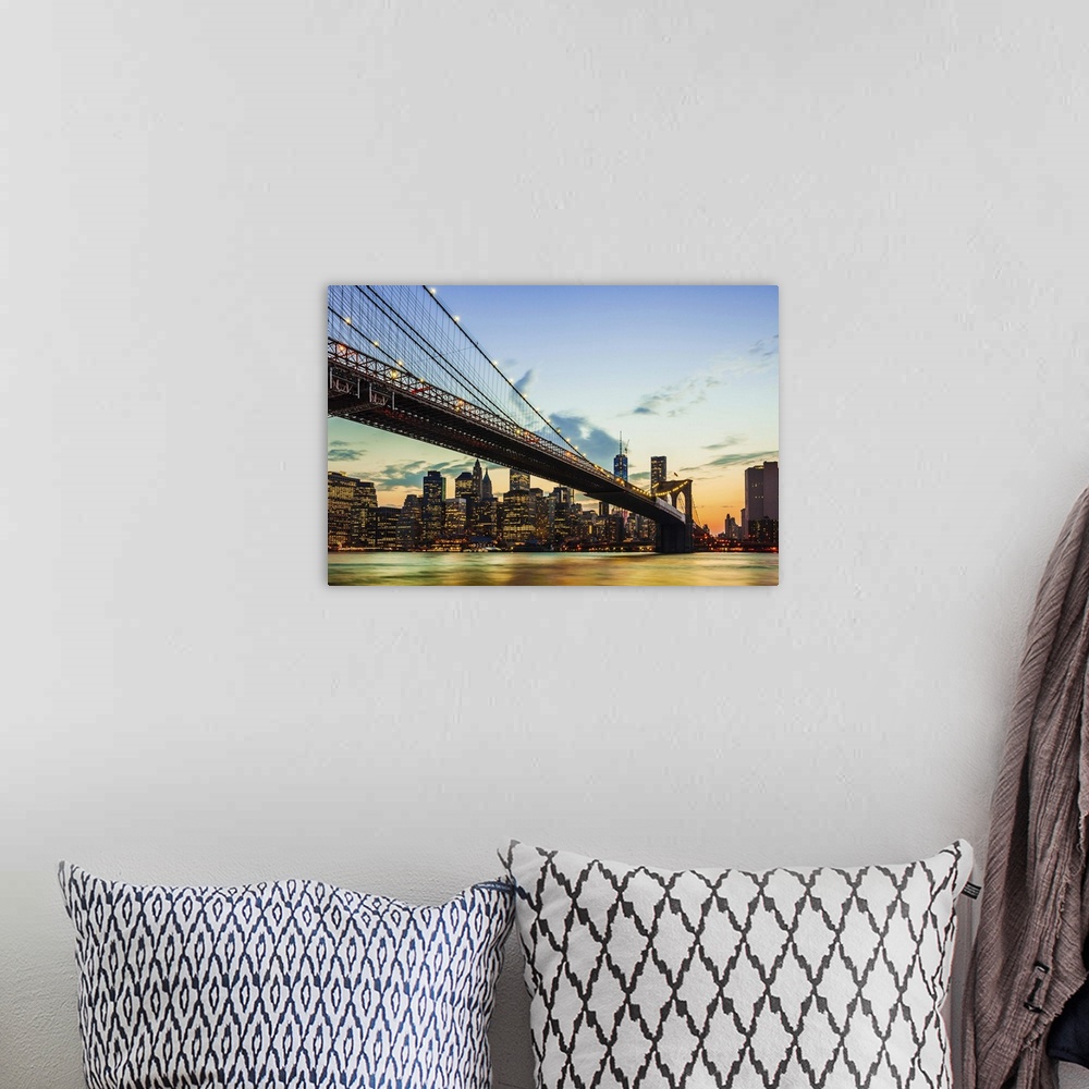 A bohemian room featuring Photograph of the Brooklyn Bridge spanning the East River, in the soft glow of sunset.