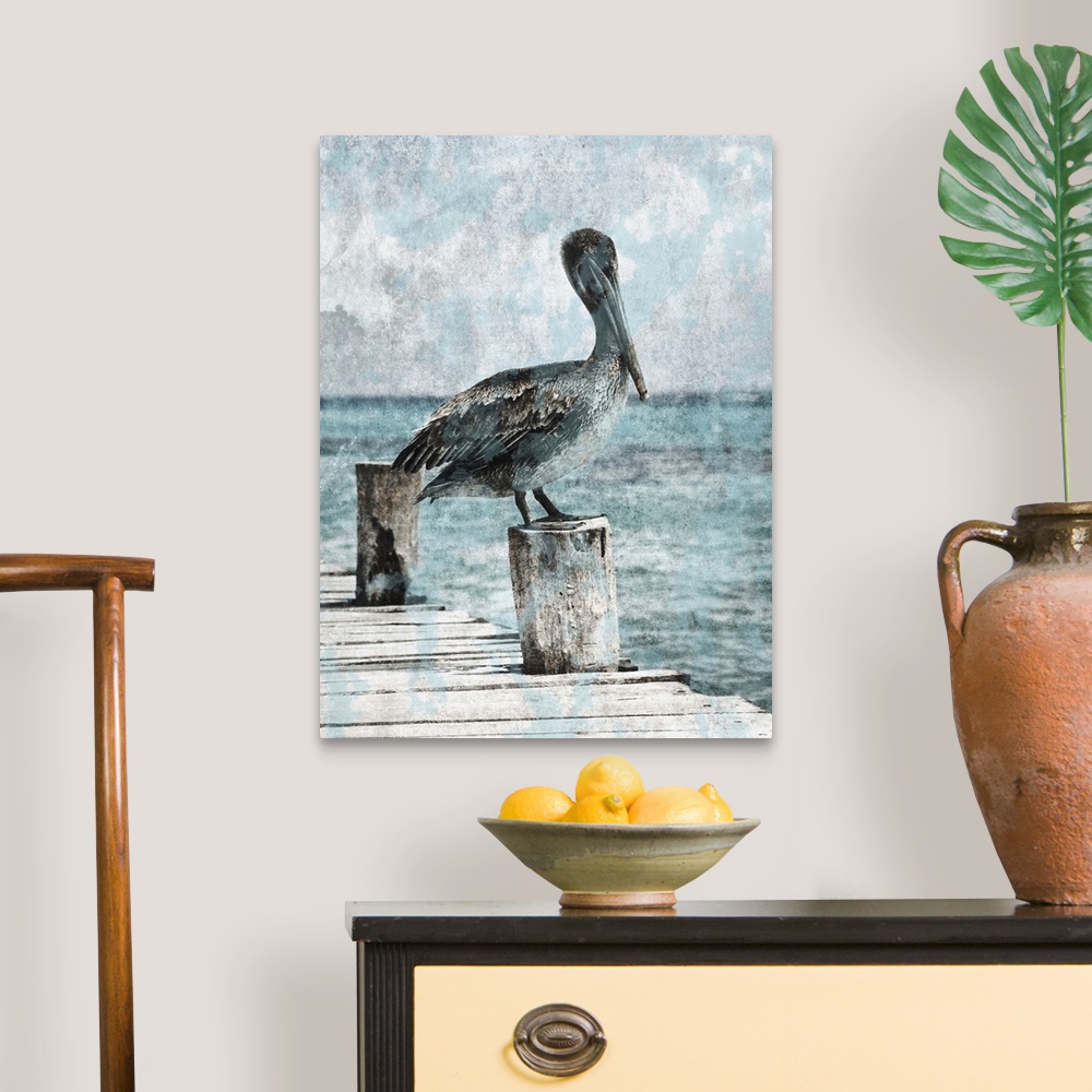 A traditional room featuring Black and white photograph of a pelican standing on a dock with light blue tones painted on top.