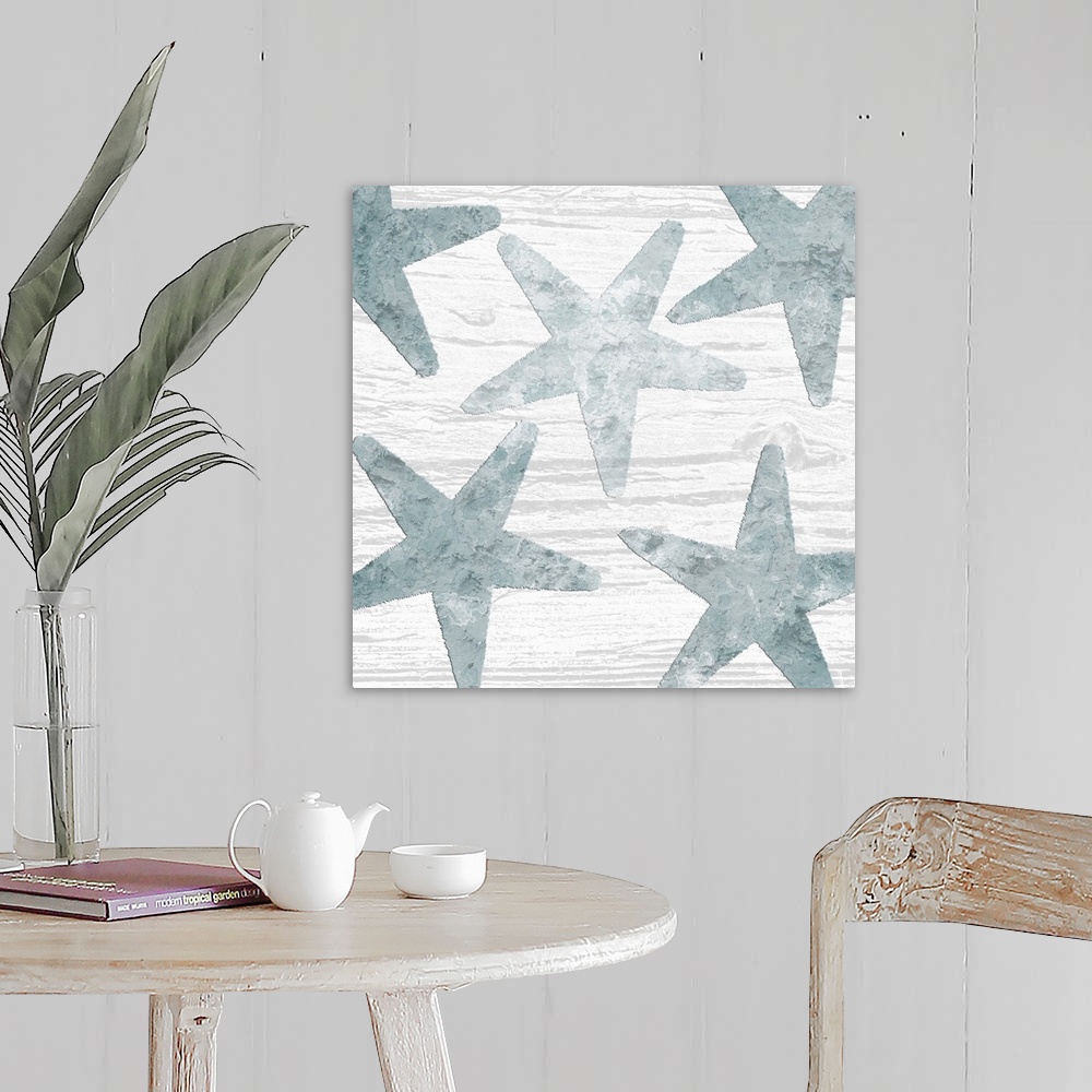 A farmhouse room featuring Square watercolor painting of blue starfish on a white wood grain background.