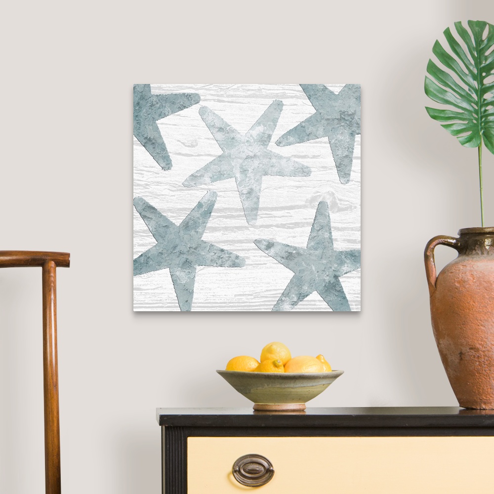 A traditional room featuring Square watercolor painting of blue starfish on a white wood grain background.