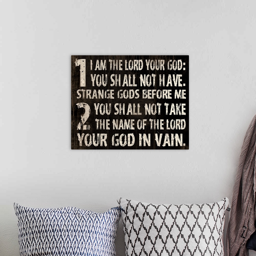 A bohemian room featuring Religious typography art, with the first two commandments in a weathered, rustic look.