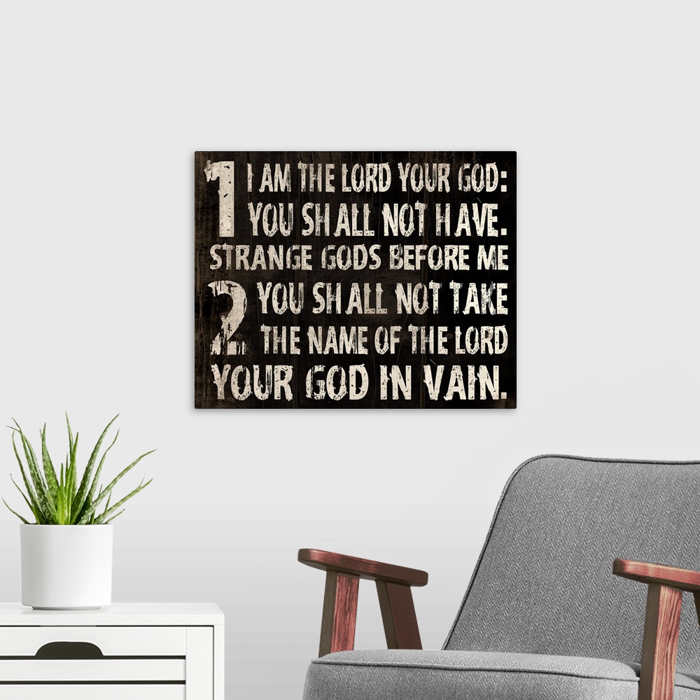A modern room featuring Religious typography art, with the first two commandments in a weathered, rustic look.