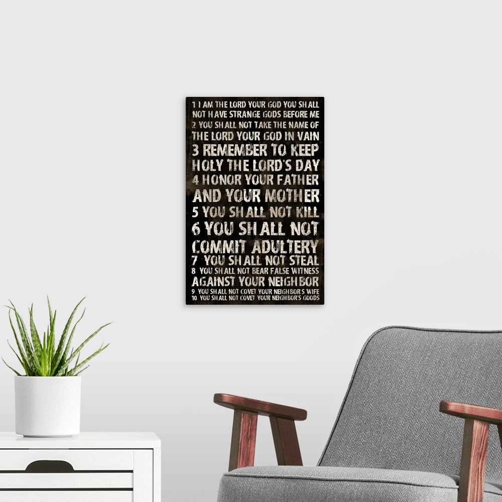A modern room featuring Religious typography art, with the ten commandments in a weathered, rustic look.