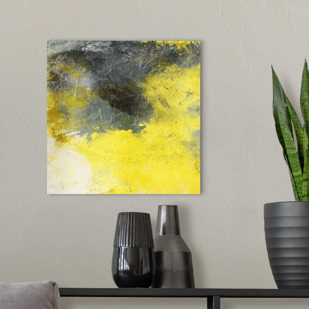 A modern room featuring Bright yellow and dark gray merging together in this abstract painting.