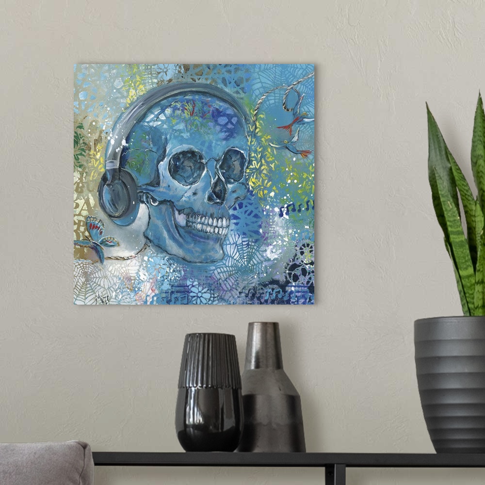 A modern room featuring Contemporary painting of a skull wearing headphones.