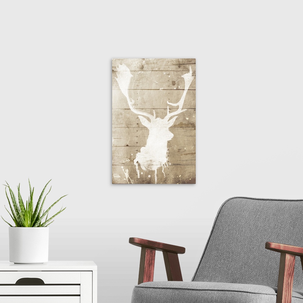 A modern room featuring A white silhouette of a deer painted on a wood background with some paint drips and splatter.