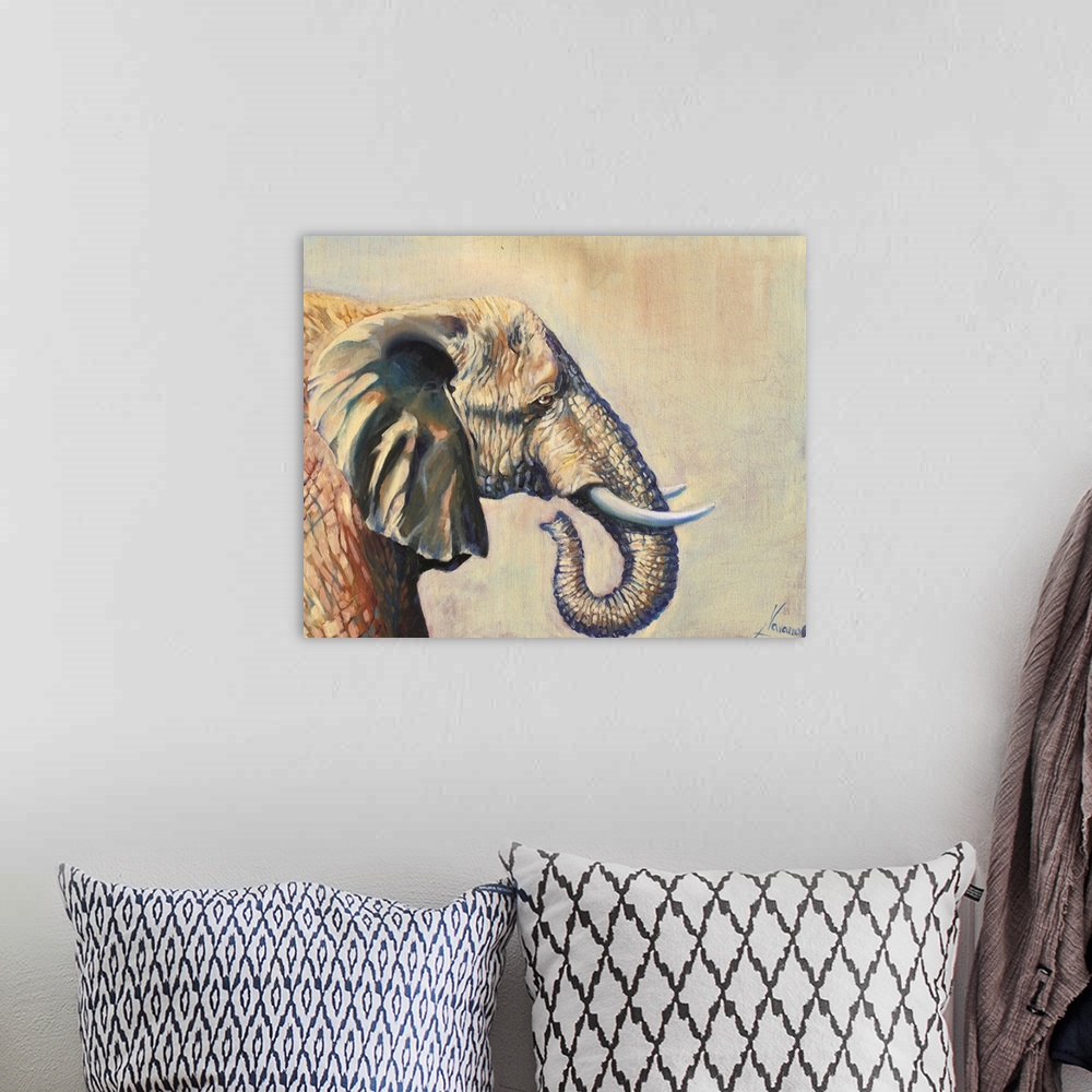 A bohemian room featuring Contemporary paining of an elephant in profile against a pale light brown background.