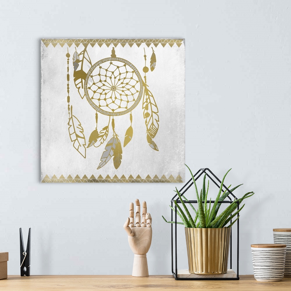 A bohemian room featuring Gold and silver dreamcatcher and feather design.