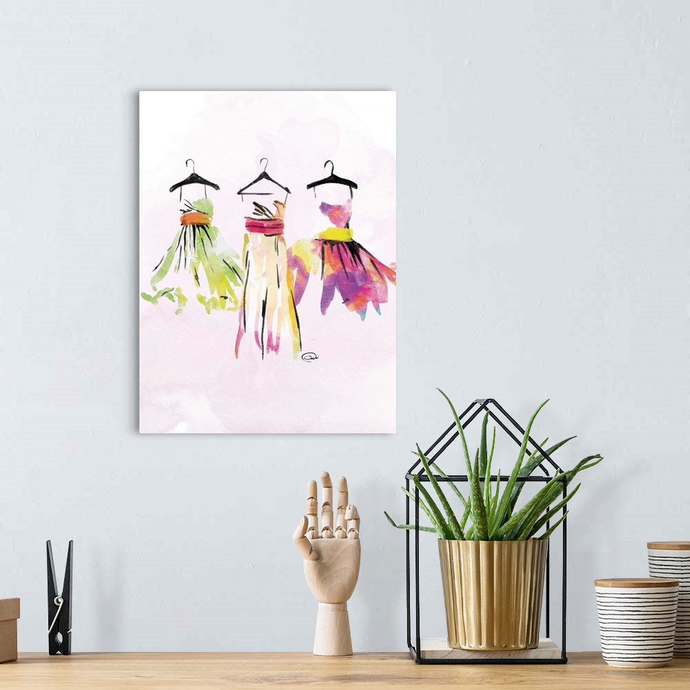 A bohemian room featuring Contemporary watercolor artwork of colorful dresses hanging on black hangers against a pale pink ...