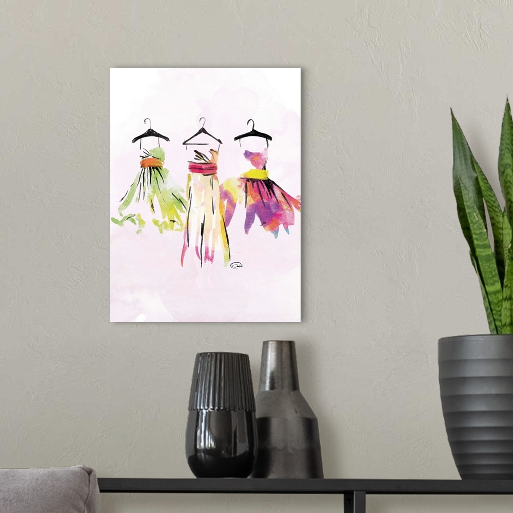 A modern room featuring Contemporary watercolor artwork of colorful dresses hanging on black hangers against a pale pink ...