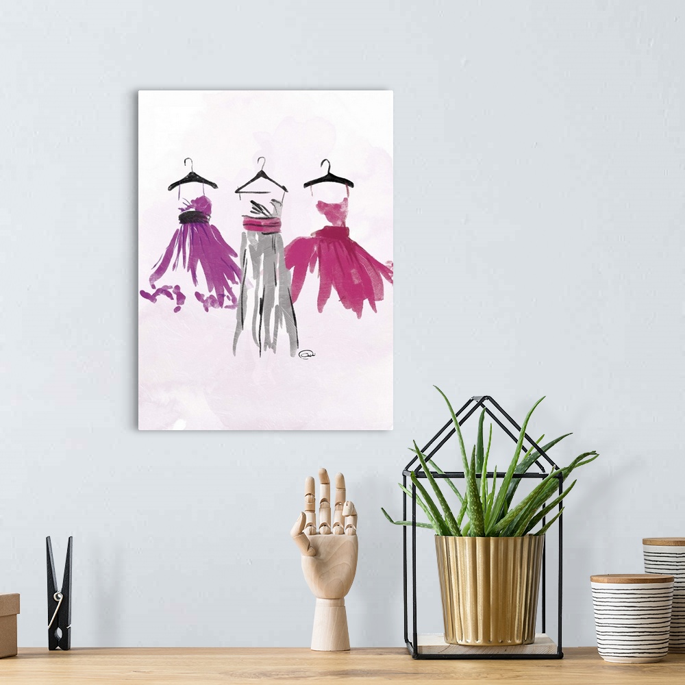 A bohemian room featuring Contemporary watercolor artwork of colorful dresses hanging on black hangers against a pale pink ...