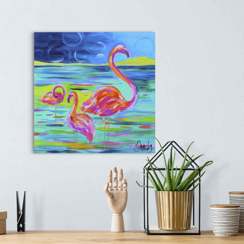 A bohemian room featuring Contemporary painting of a flamingo family standing in water.