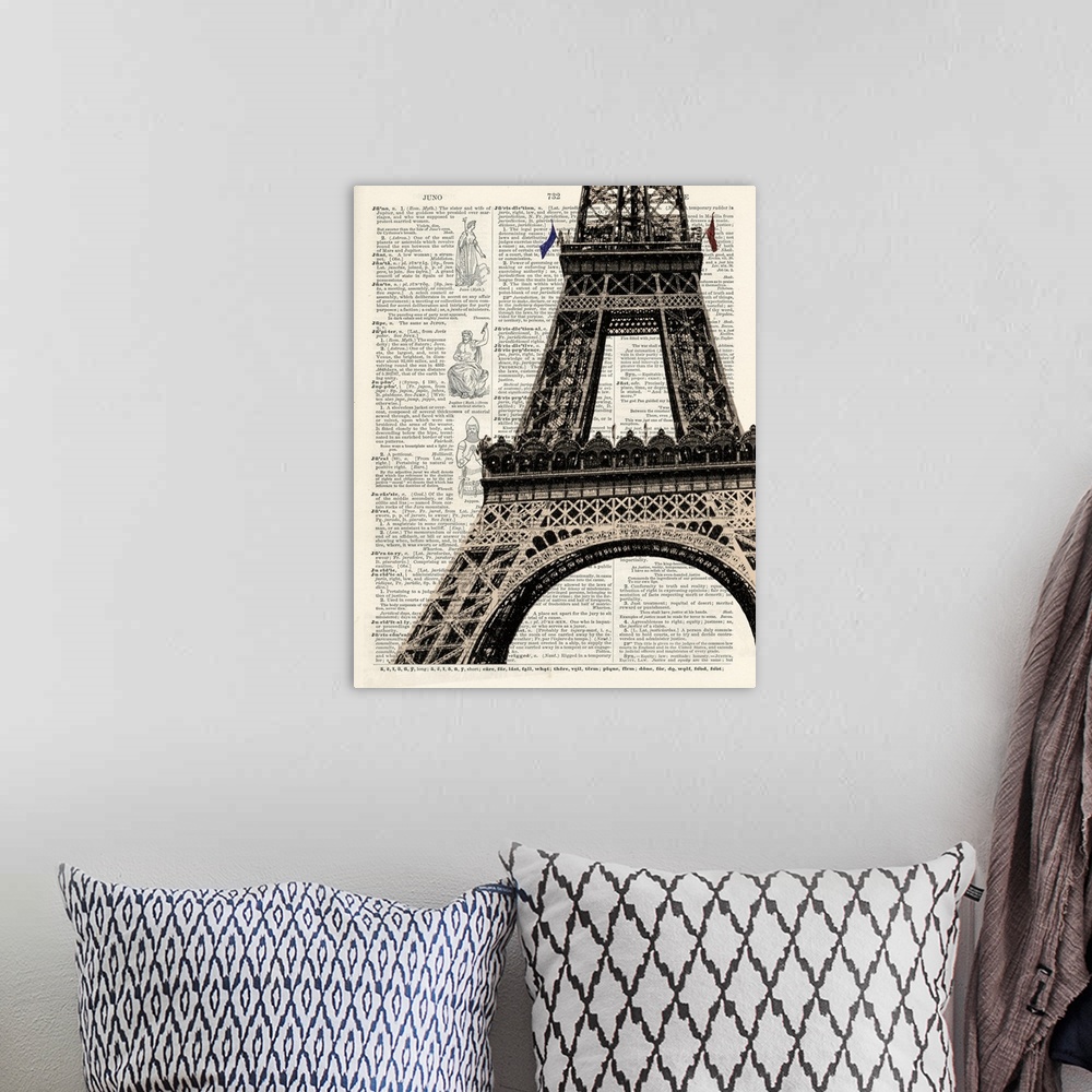 A bohemian room featuring Contemporary artistic use of a page from a dictionary with the Eiffel Tower on top of the text.