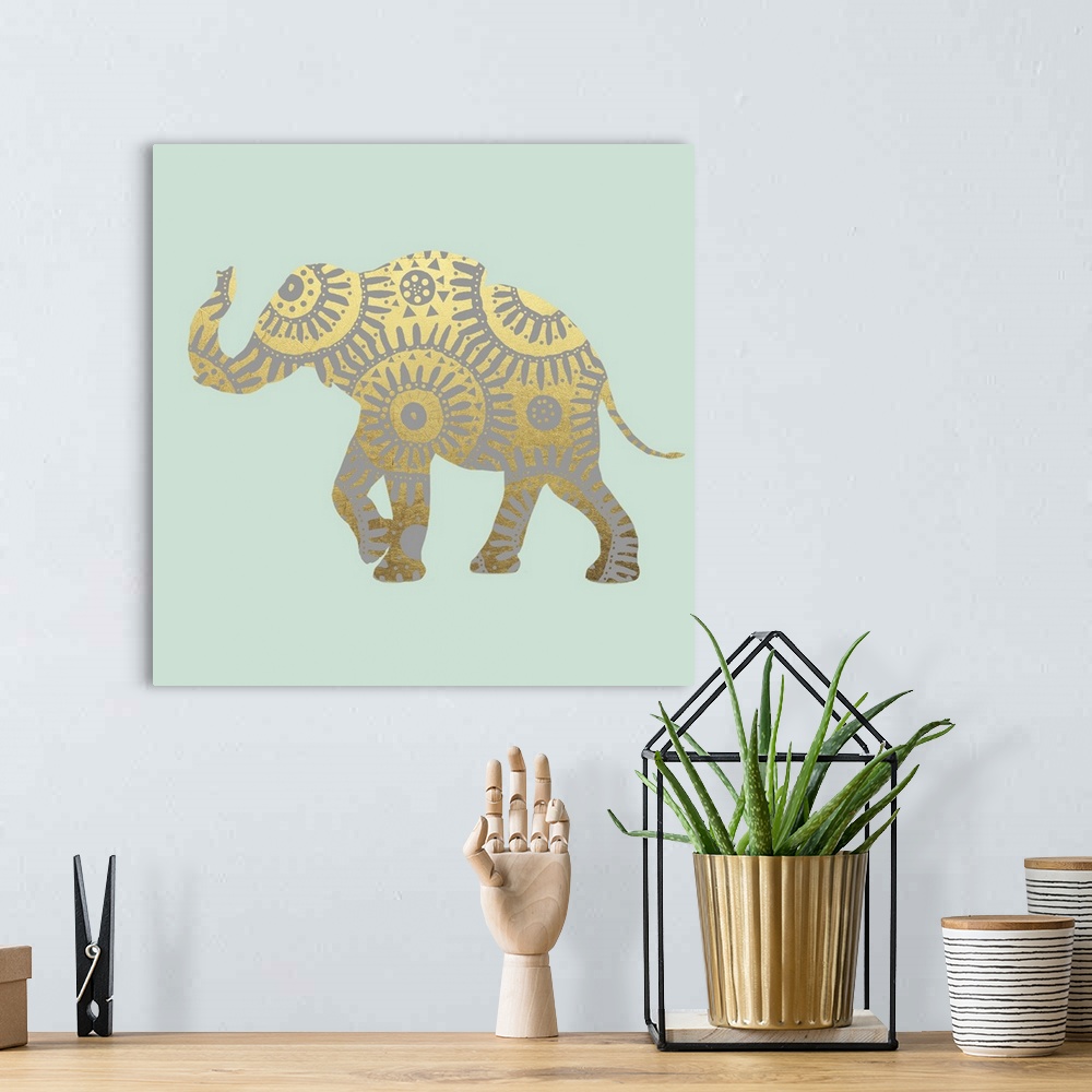 A bohemian room featuring Square illustration of a metallic gold elephant with silver designs on a light green background.