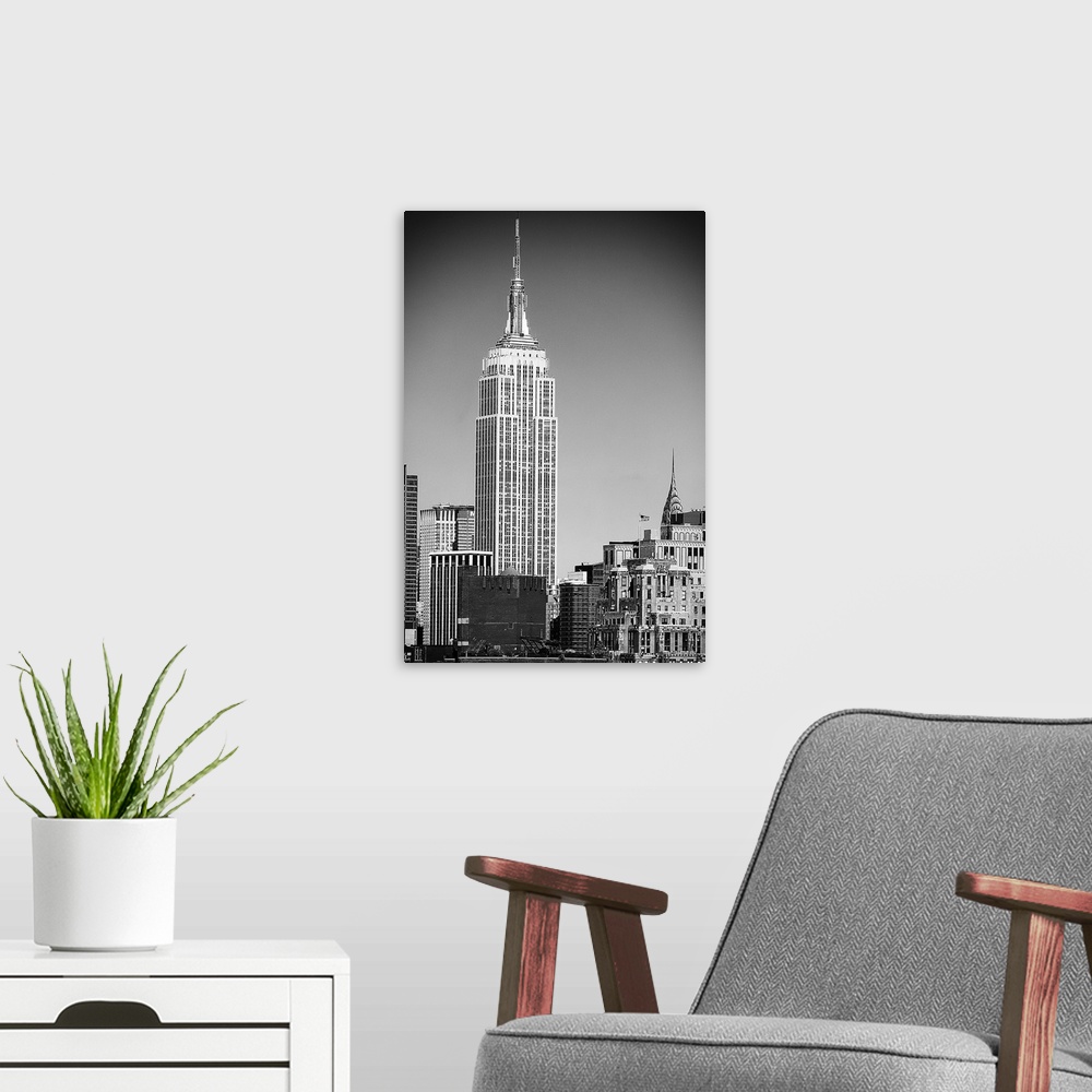 A modern room featuring Black and white photograph of New York City. With the Empire State building prominently standing ...