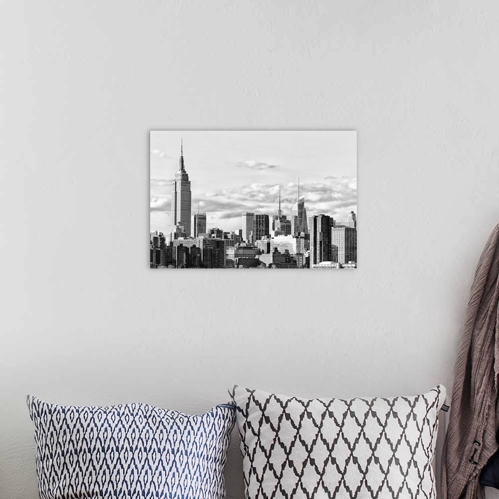 A bohemian room featuring Black and white photograph of the New York City skyline. With the Empire State Building prominent...