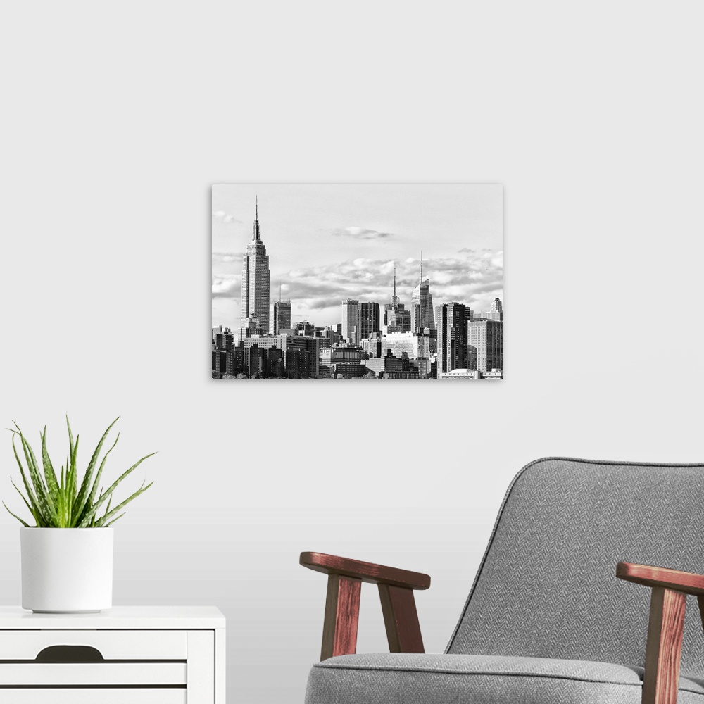 A modern room featuring Black and white photograph of the New York City skyline. With the Empire State Building prominent...