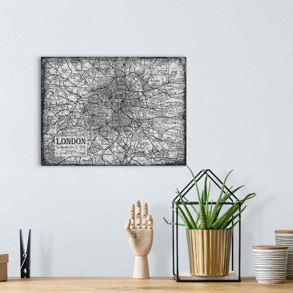 A bohemian room featuring Rustic contemporary art map of London districts, in black and white.