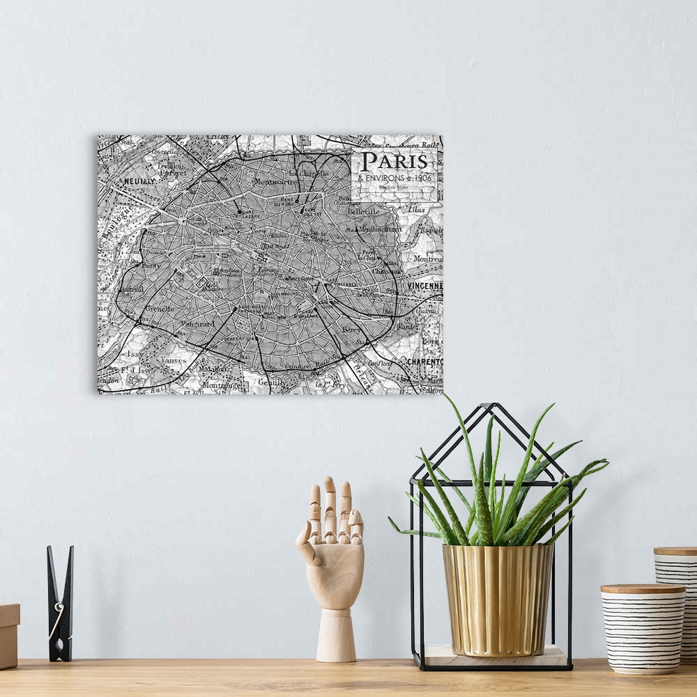A bohemian room featuring Rustic contemporary art map of Paris districts, in black and white.