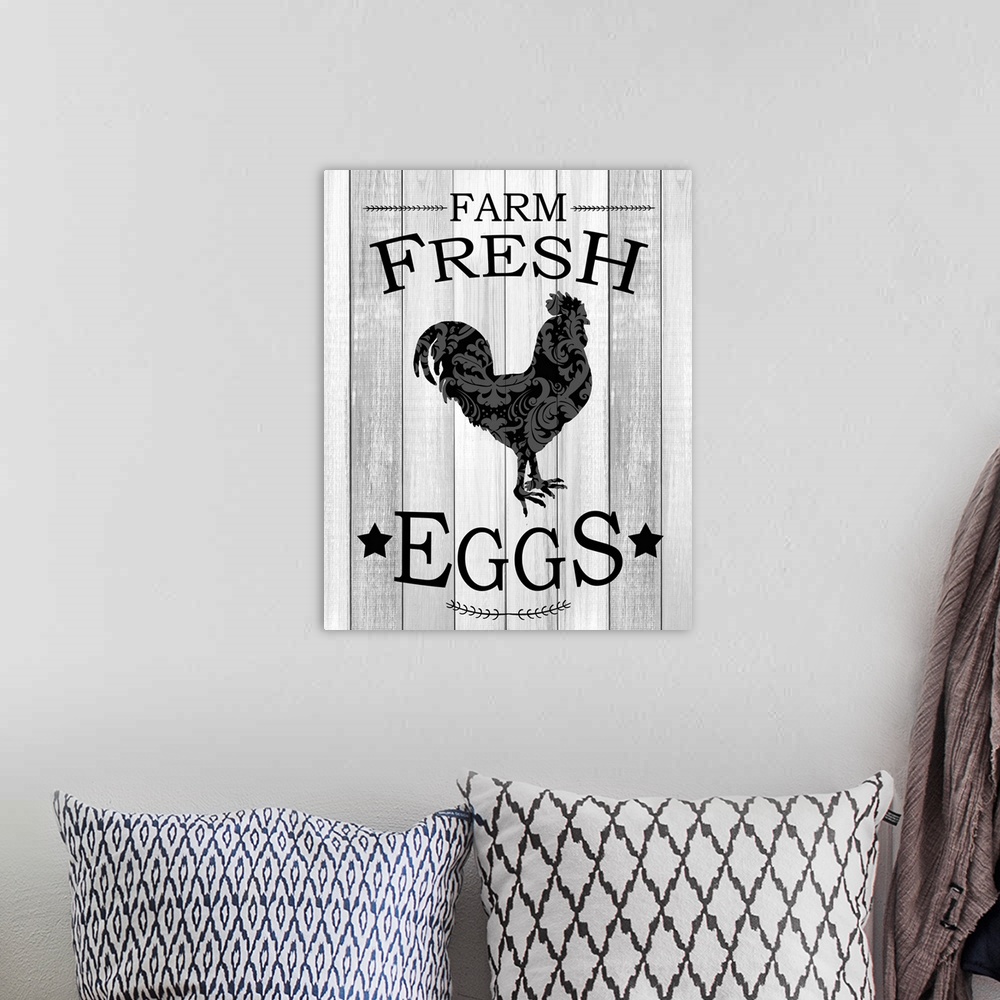 A bohemian room featuring "Farm Fresh Eggs" with a silhouette of a chicken in a paisley pattern on gray wooded boards.