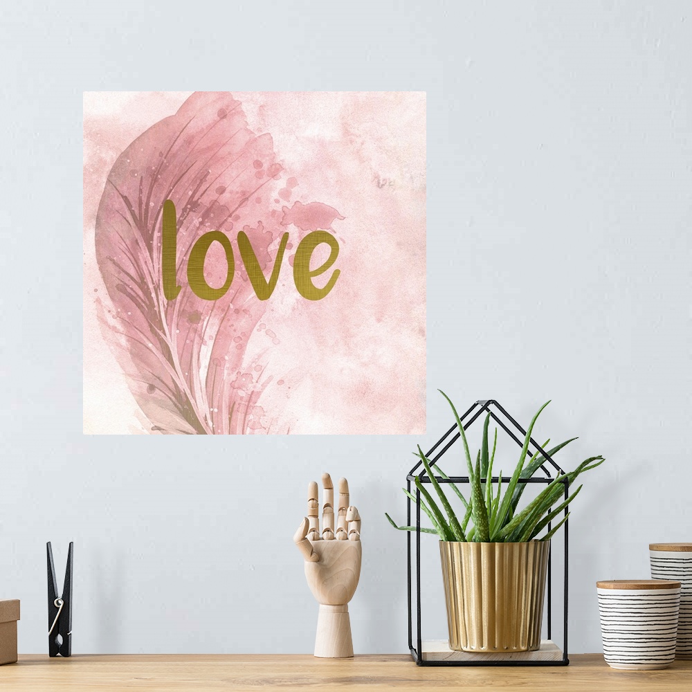 A bohemian room featuring A pink watercolor painting of a feather with the word ?love? placed on top in gold text.�