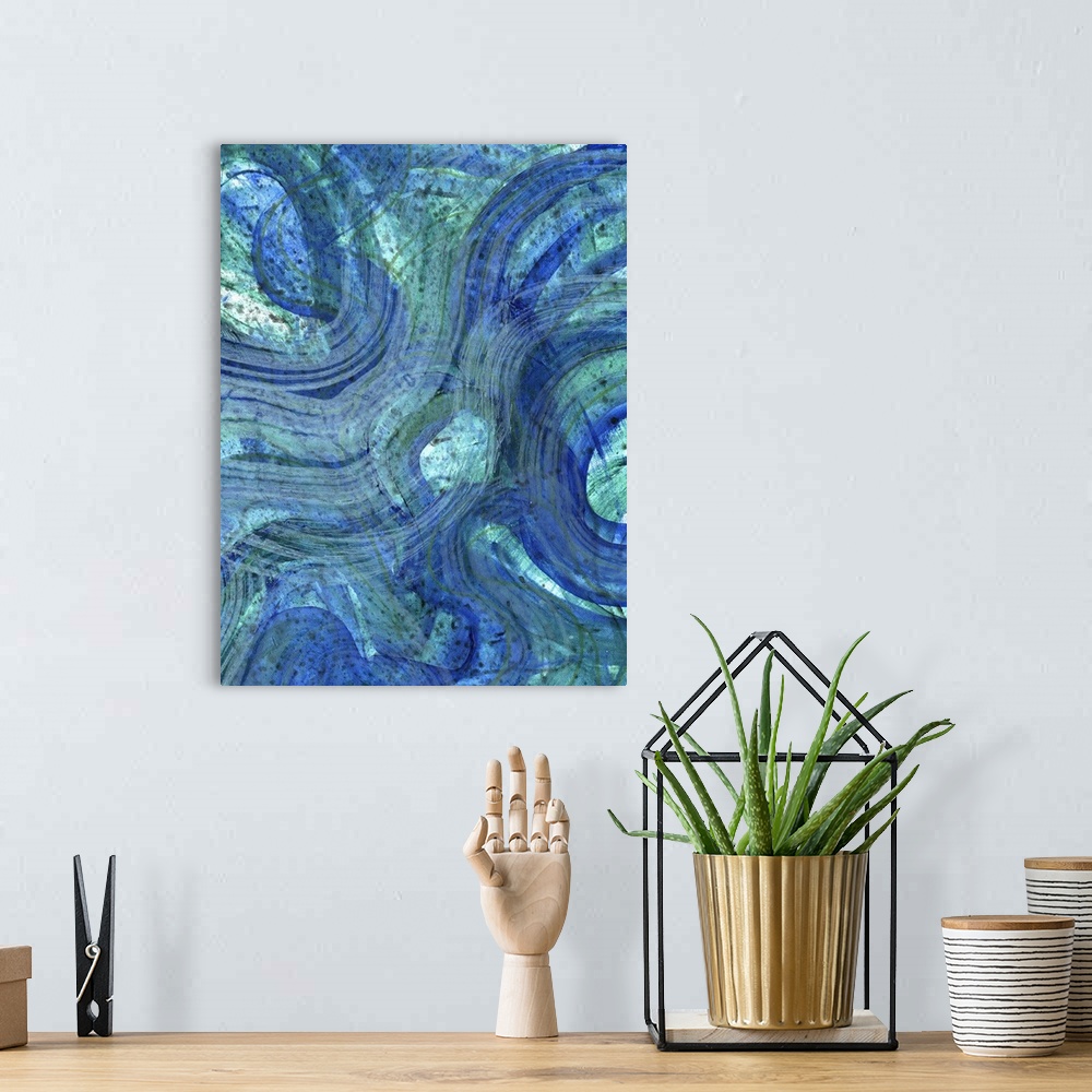 A bohemian room featuring Contemporary abstract artwork resembling waves in deep blue water.