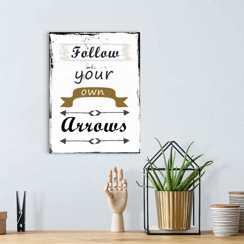 A bohemian room featuring Follow Your Own Arrows