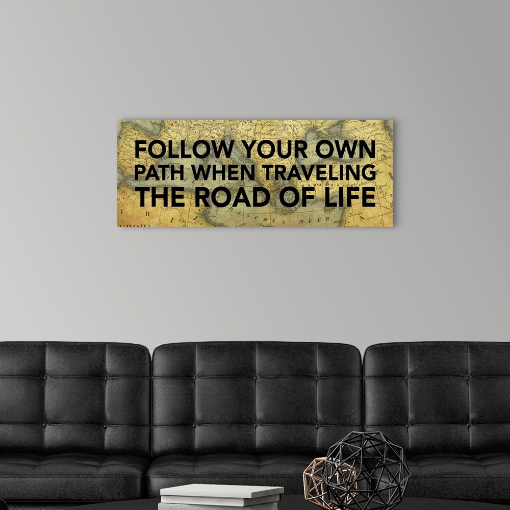 A modern room featuring Artwork of inspirational quote with a vintage map of the world in the background.