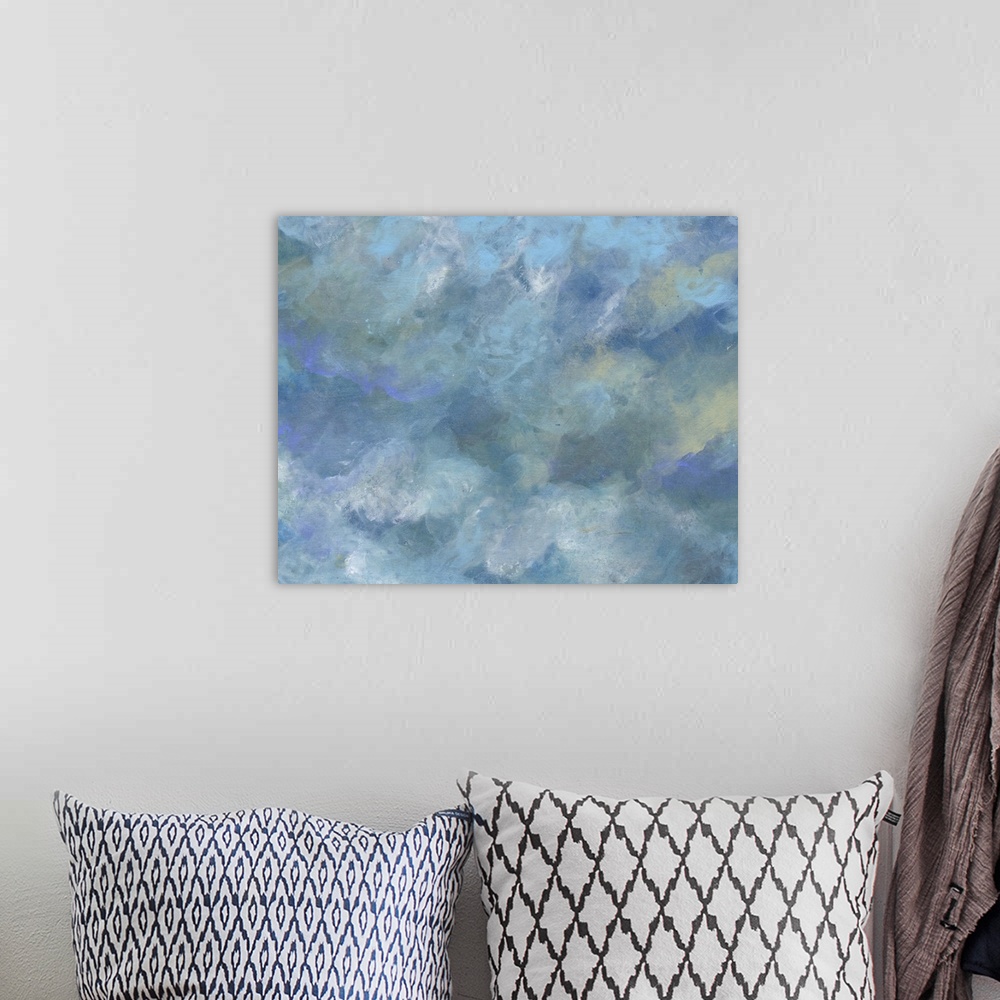 A bohemian room featuring Contemporary painting of a cloudy sky in shades of blue and grey.