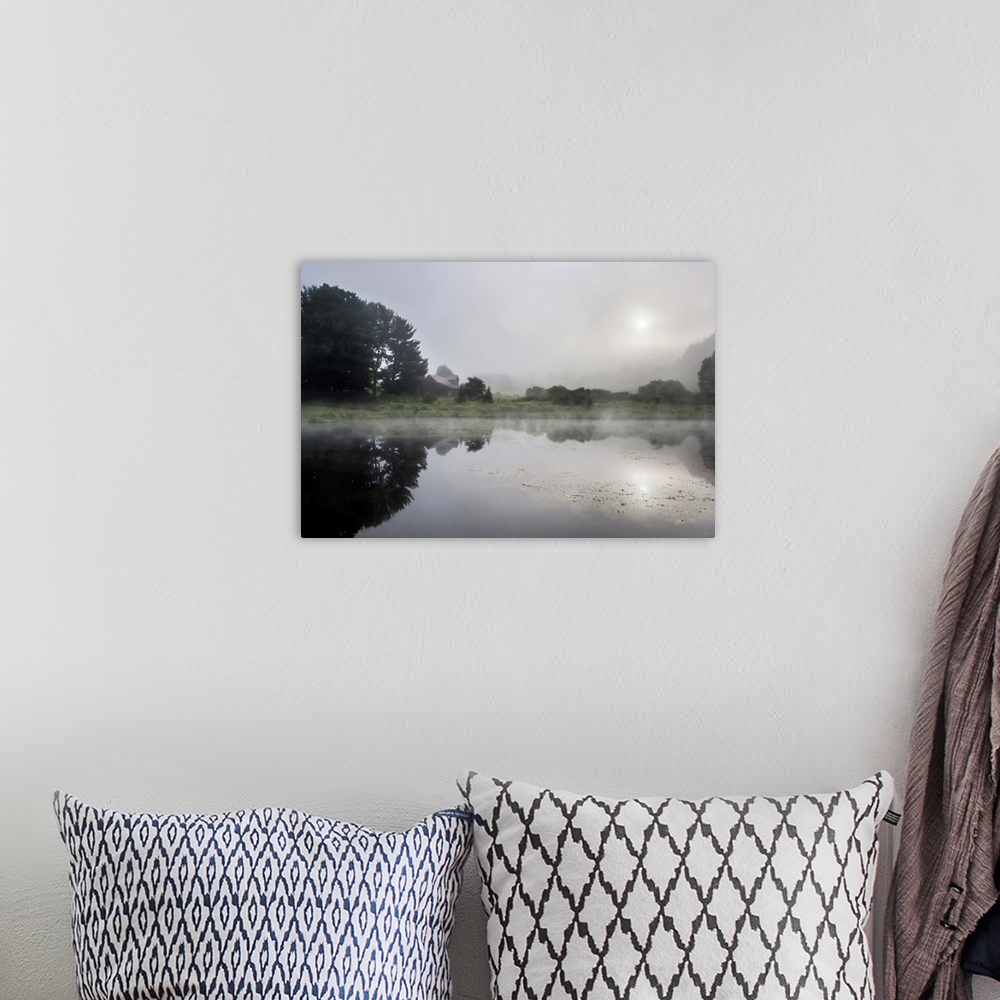 A bohemian room featuring Fine art photo of a calm lake reflecting the surrounding trees and morning sun.