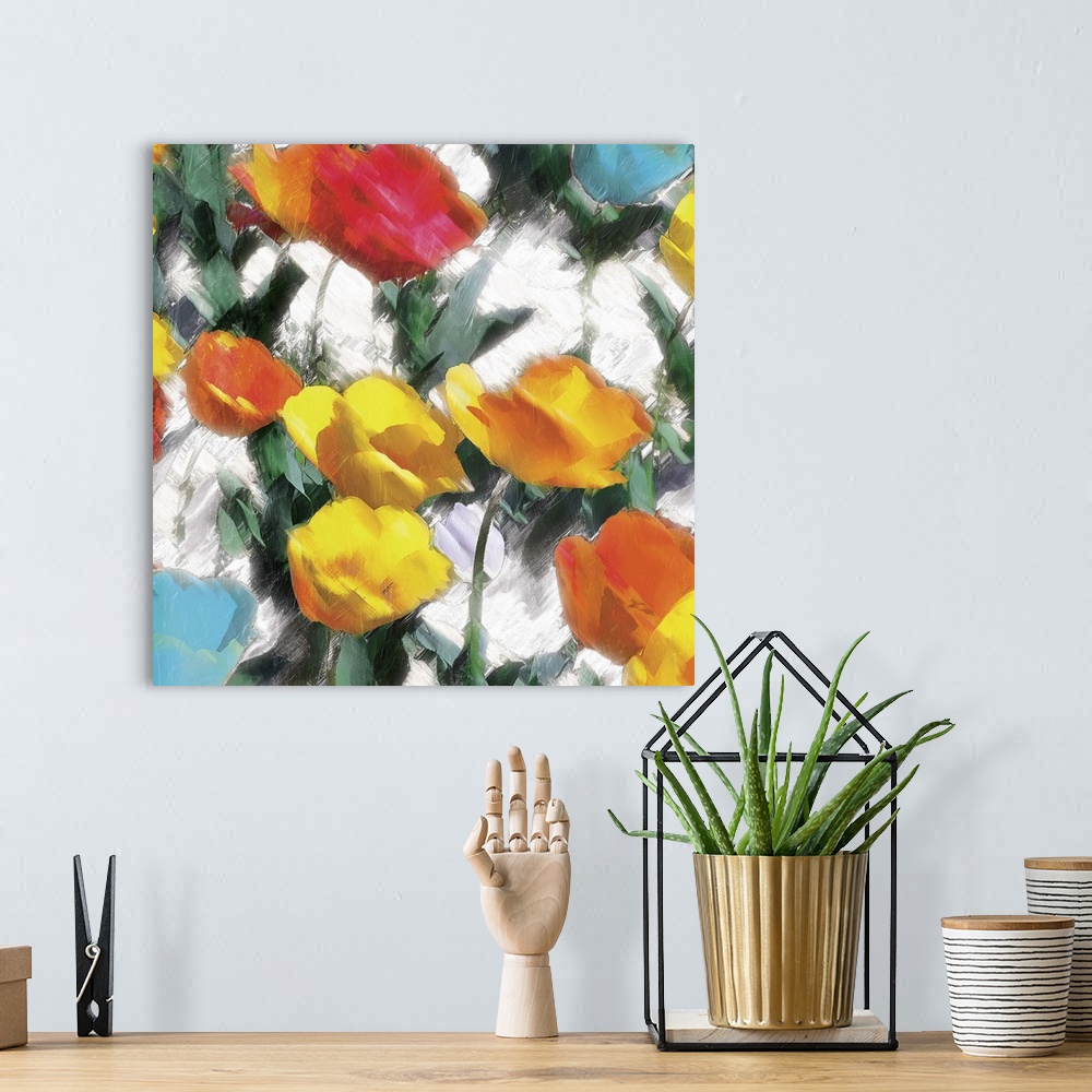 A bohemian room featuring A bright and colorful abstract painting of yellow, orange, red, and blue flowers on a white backg...